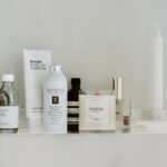 A bathroom shelf of moisturiser bottles, tubes and jars to choose from