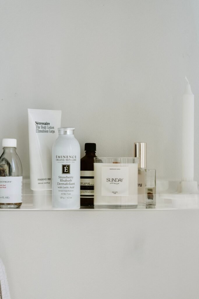 A bathroom shelf of moisturiser bottles, tubes and jars to choose from